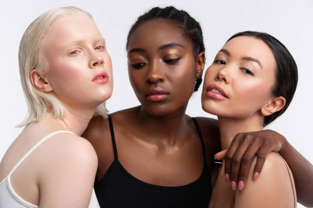 istock Females with different complexion posing together in photo shoot 1141299374