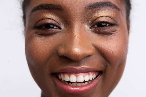 istock Beaming dark-skinned woman smiling broadly feeling amazing 1141299392