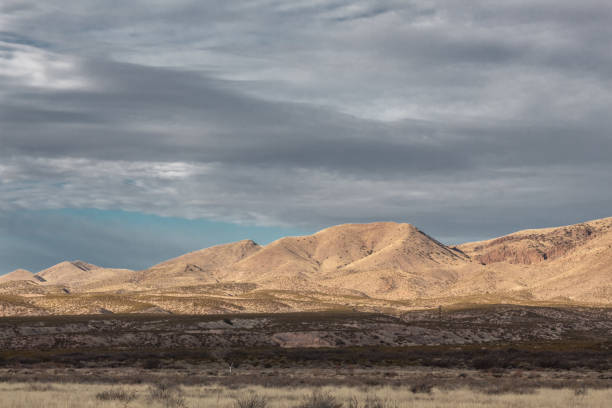 istock Bosque del Apache New Mexico, mountains before dark skies in winter 1141299610