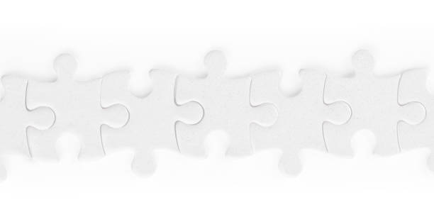 istock White jigsaw puzzle pieces row isolated with clipping path 1141299790