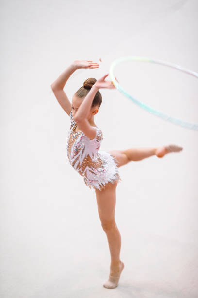 istock Little gymnast training on the carpet and ready for competitions 1141301046