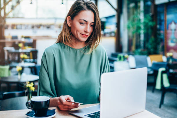 istock Young woman shopping on-line 1141302387