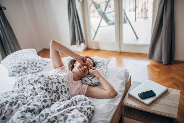 istock Happy woman is waking up 1141303595