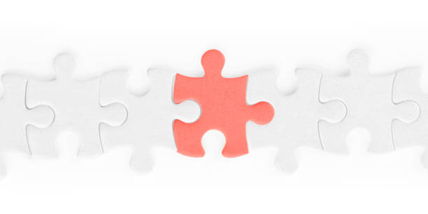 istock White jigsaw puzzle pieces row with red one isolated with clipping path 1141303597