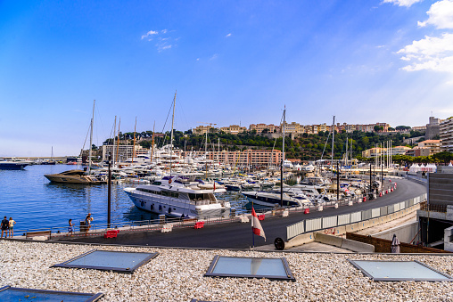 Yachts in bay near houses and hotels, La Condamine, Monte-Carlo, Monaco, Cote d'Azur, French Riviera.