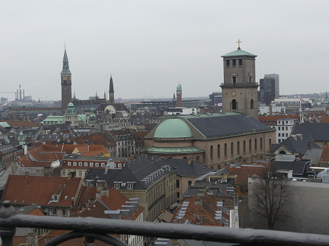 COPENHAGEN, DENMARK - MARCH 2019: Panorama of the city. View of the city from a height. Historical real estate of the city. View from the city tower on the city.