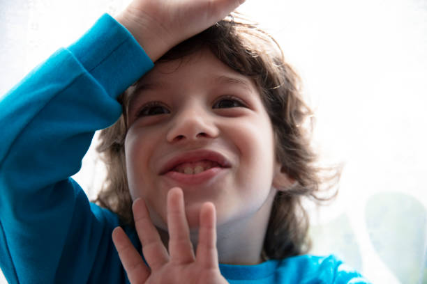 Portrait of happy cute boy having fun at home.
