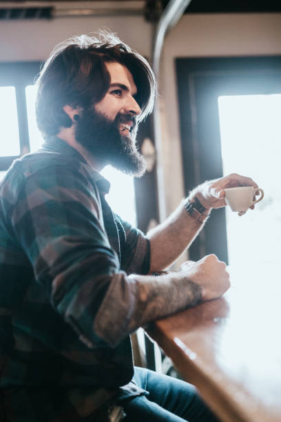 istock Handsome Bearded Man In Coffee Shop 1141309147