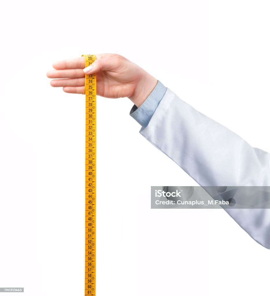 medical treatment Shot of a doctor hand holding a tape measure on a white isolated background and isolated Reduction Stock Photo