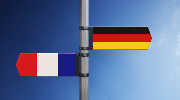 French and German flag pair. Horizontal composition with copy space and selective focus. Dispute concept.