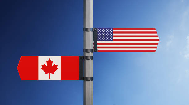 american and canadian flag pair - canada american flag canadian culture usa stock-fotos und bilder