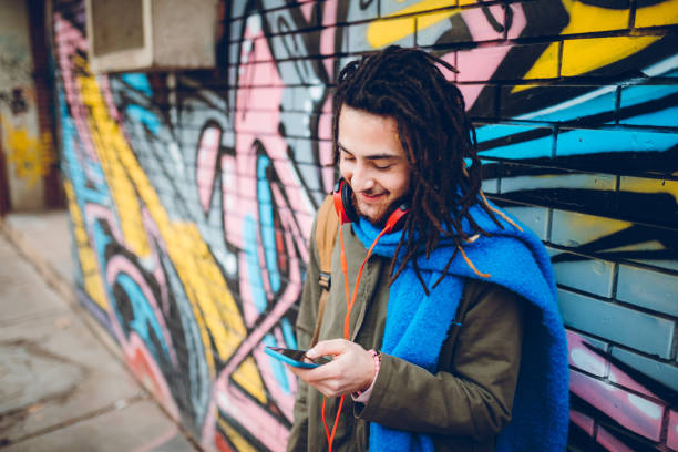 istock Young man with dreadlocks enjoys music 1141313906