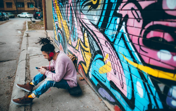 istock Young man with dreadlocks enjoys music 1141313958
