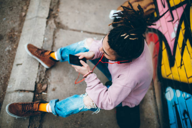 istock Young man with dreadlocks enjoys music 1141314022