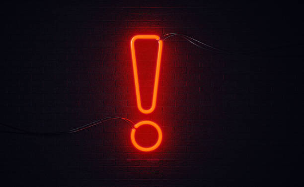 istock Exclamation Point Shaped Red Neon Light On Black Wall - Alertness Concept 1141315133