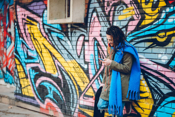istock Young man with dreadlocks enjoys music 1141315150