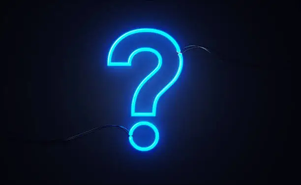 Photo of Question Mark Shaped Red Neon Light On Black Wall