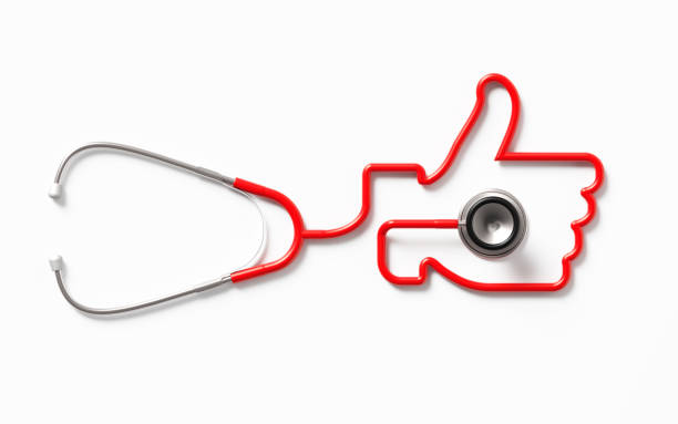 Red stethoscope forming a thumb up symbol on white background. Health concept. Horizontal composition with clipping path and copy space. Directly above.