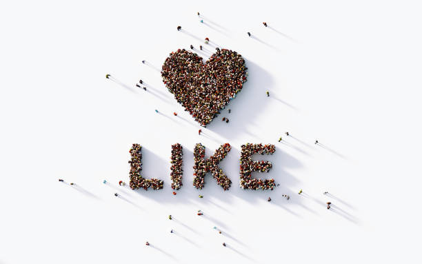 istock Human Crowd Forming A Big Like Text With Heart Shape Inside : Social Media Concept 1141315762