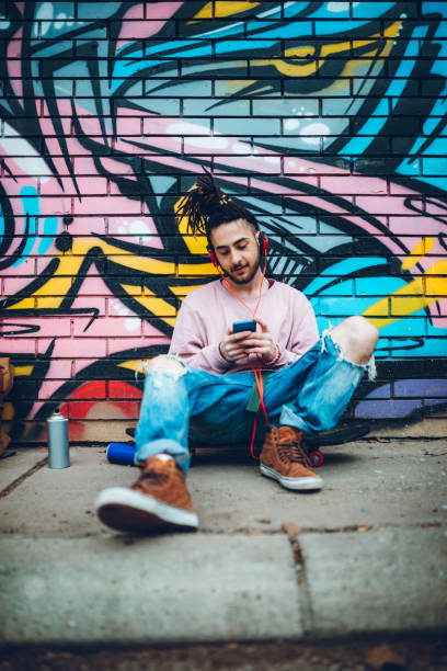 istock Graffiti artist listens to music 1141315852
