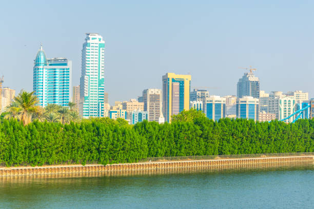 istock View of the Khalid lagoon surrounded with skyscraper in the emirate Sharjah, UAE 1141316708