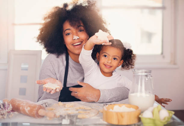 istock Mother and daughter are baking together 1141319736