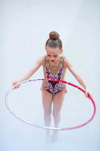 istock Little gymnast training on the carpet and ready for competitions 1141321781