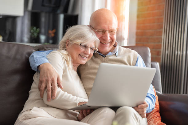 istock Senior couple browsing the internet together 1141323525