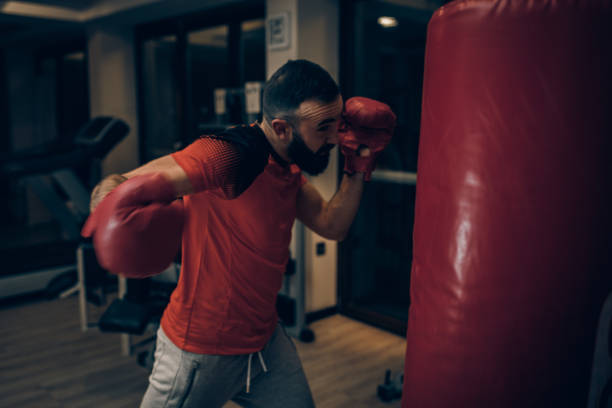 istock Handsome bearded boxer boxing in the gym 1141326867