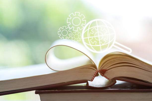 istock SEO search engine or E-book online learning for study concept with Magnifying glass with gear engine on global world checklist on open textbook background. Ideas for analysis over information and data 1141327732