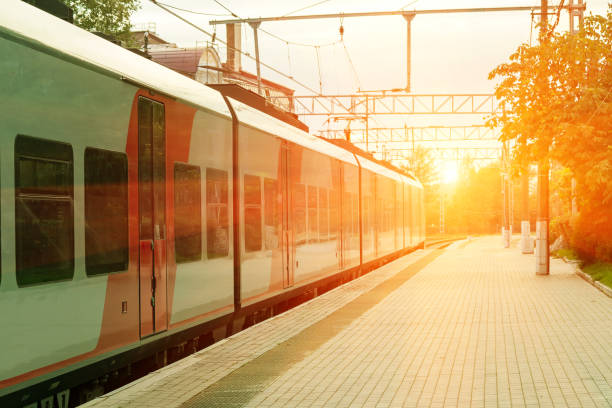 istock Train near the empty train platform on a summer evening 1141328874
