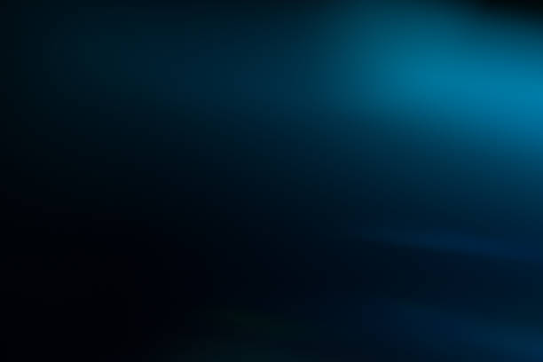 istock lens flare defocused blurred light shine dark blue 1141329917