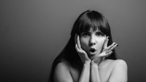 istock astonished excited surprised emotion lady portrait 1141329949