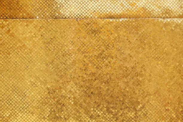 Photo of texture of thai tradition golden tile glass mosaic wall