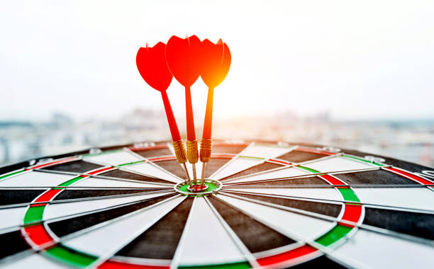 istock Dart board with three darts outdoors 1141338812