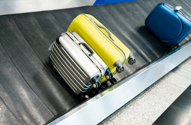 istock Suitcases on conveyor belt in the airport 1141341733