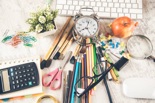 istock keyboard with stationary and clock on desk 1141341790