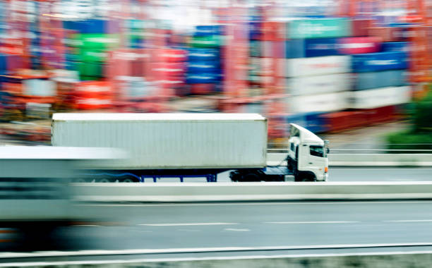 istock White truck leaving the harbor 1141342158