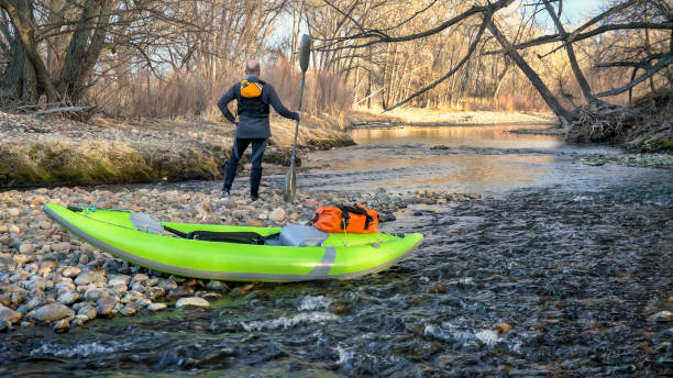 istock paddler with whitewater inflatable kayak 1141353465