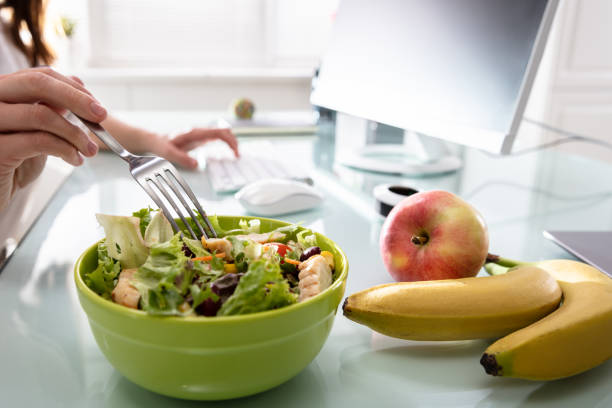 istock Healthy Salad On Office Desk 1141353505