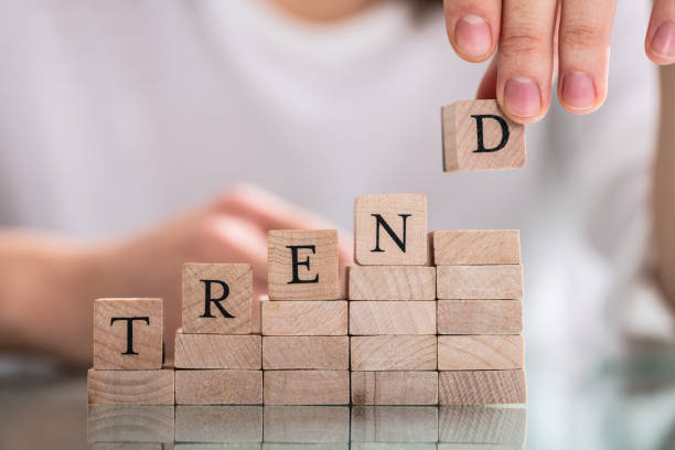 istock Hand Holding Wooden Block From Word Trend 1141353587