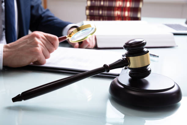 istock Justice Working On Legal Document In Courtroom 1141354648