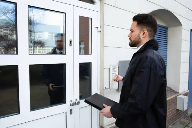 Photo of Man Pressing The Door Bell