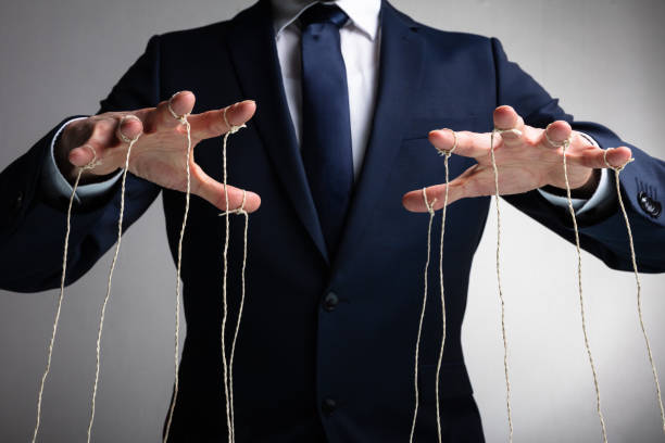 hand manipulate threaded puppet marionette, human manager master