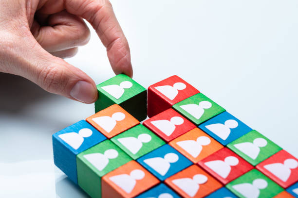 istock Businessperson's Hand Holding Green Cubic Block 1141354704