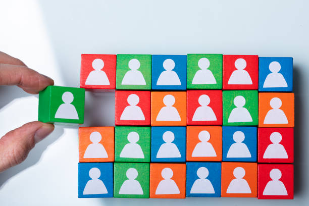 istock Businessperson's Hand Holding Green Cubic Block 1141354706