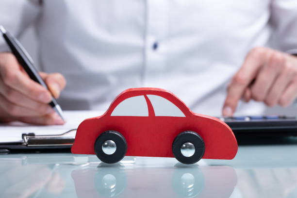 istock Businessman Calculating Car Loan 1141354711