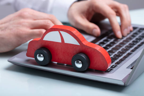 istock Small Red Car On Laptop Keypad 1141354714