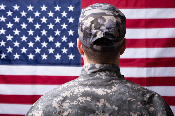 istock Soldier In Front Of Us Flag 1141354783