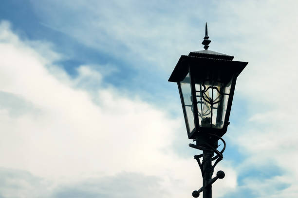istock Antique Street Light isolated on a blue sky background. 1141357029